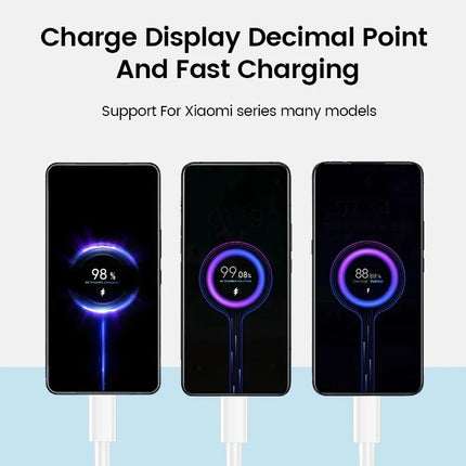 USB-C charging cable connected to phones showing charge levels